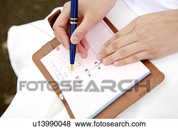 Stock Photo - woman who attends 
a notebook. fotosearch 
- search stock 
photos, pictures, 
images, and photo 
clipart