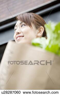 Stock Photography - woman who makes 
a purchase. fotosearch 
- search stock 
photos, pictures, 
images, and photo 
clipart