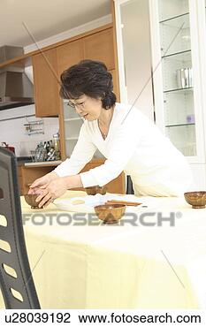 Stock Photo - woman putting 
miso soup. fotosearch 
- search stock 
photos, pictures, 
images, and photo 
clipart