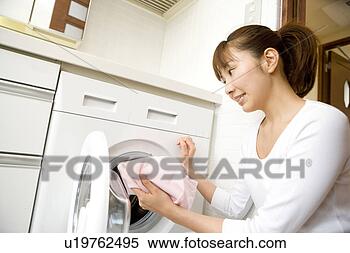 Stock Image - woman washing 
clothes. fotosearch 
- search stock 
photos, pictures, 
images, and photo 
clipart