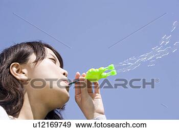 Stock Photograph - woman who plays 
with the soap 
bubble. fotosearch 
- search stock 
photos, pictures, 
images, and photo 
clipart