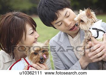 Stock Photography - couple and dogs. 
fotosearch - search 
stock photos, 
pictures, images, 
and photo clipart
