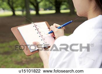 Stock Photo - woman who attends 
a notebook. fotosearch 
- search stock 
photos, pictures, 
images, and photo 
clipart