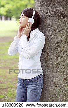 Stock Photography - woman who hangs 
upon the music. 
fotosearch - search 
stock photos, 
pictures, images, 
and photo clipart