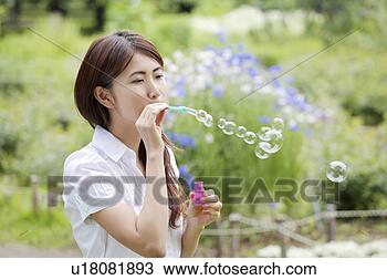 Stock Photo - woman who does 
a soap bubble. 
fotosearch - search 
stock photos, 
pictures, images, 
and photo clipart