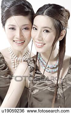 Stock Photo - a portrait of 
two young women. 
fotosearch - search 
stock photos, 
pictures, images, 
and photo clipart