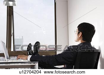 Stock Photo - a resting office 
man. fotosearch 
- search stock 
photos, pictures, 
images, and photo 
clipart