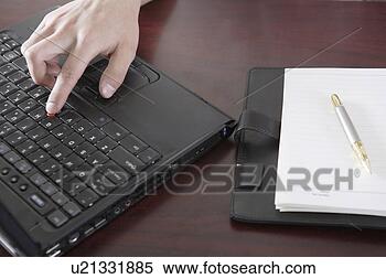 Stock Image - using laptop. 
fotosearch - search 
stock photos, 
pictures, images, 
and photo clipart