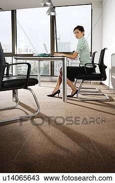 Stock Photo - young woman playing 
laptop at office. 
fotosearch - search 
stock photos, 
pictures, images, 
and photo clipart