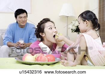 Stock Photo - family sharing 
milk and fruit 
at home. fotosearch 
- search stock 
photos, pictures, 
images, and photo 
clipart