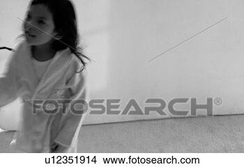 Stock Photo - girl in bath gown 
standing in front 
of a wall. fotosearch 
- search stock 
photos, pictures, 
images, and photo 
clipart
