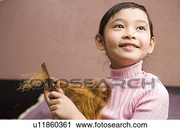 Stock Photography - girl combing for 
doll. fotosearch 
- search stock 
photos, pictures, 
images, and photo 
clipart