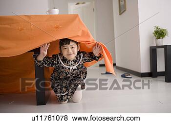 Stock Photo - girl under table. 
fotosearch - search 
stock photos, 
pictures, images, 
and photo clipart