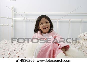 Stock Photo - girl wrapping 
herself with a 
bath gown and 
a quilt in bed. 
fotosearch - search 
stock photos, 
pictures, images, 
and photo clipart