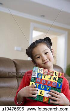 Stock Photo - gril holding a 
speller. fotosearch 
- search stock 
photos, pictures, 
images, and photo 
clipart