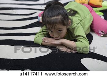 Stock Photography - a lying girl. 
fotosearch - search 
stock photos, 
pictures, images, 
and photo clipart