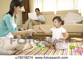 Stock Photo - mother and daughter 
playing on fabric. 
fotosearch - search 
stock photos, 
pictures, images, 
and photo clipart