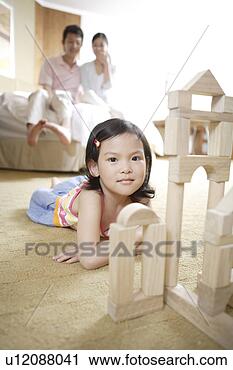 Stock Photography - young daughter 
playing toy bricks. 
fotosearch - search 
stock photos, 
pictures, images, 
and photo clipart
