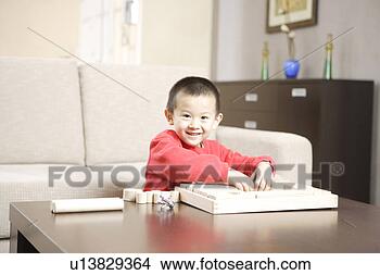 Stock Photo - boy playing with 
building block 
at home. fotosearch 
- search stock 
photos, pictures, 
images, and photo 
clipart