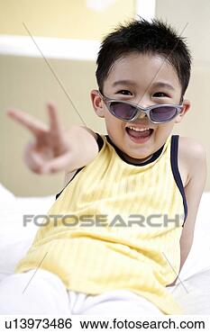 Stock Photo - boy wearing sunglasses 
and smiling. fotosearch 
- search stock 
photos, pictures, 
images, and photo 
clipart