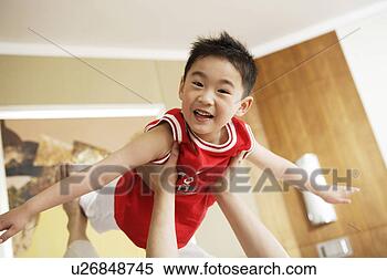 Stock Image - a flying boy. 
fotosearch - search 
stock photos, 
pictures, images, 
and photo clipart