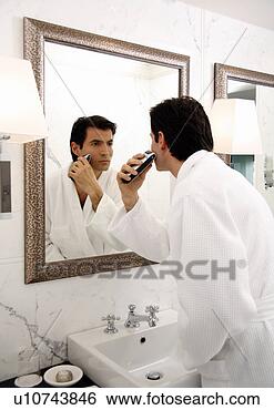 Stock Photo - man shaving in 
the bathroom mirror. 
fotosearch - search 
stock photos, 
pictures, images, 
and photo clipart