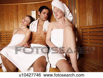 Stock Photo - man with two young 
women enjoying 
a sauna. fotosearch 
- search stock 
photos, pictures, 
images, and photo 
clipart