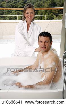 Stock Photography - mature couple 
having fun in 
the bathtub. fotosearch 
- search stock 
photos, pictures, 
images, and photo 
clipart