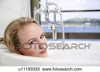 Stock Photo - woman enjoying 
bubble bath. fotosearch 
- search stock 
photos, pictures, 
images, and photo 
clipart