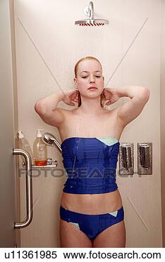Stock Image - woman taking a 
shower at the 
gym. fotosearch 
- search stock 
photos, pictures, 
images, and photo 
clipart