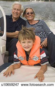 Picture - grandparents and 
grandson on boat. 
fotosearch - search 
stock photos, 
pictures, images, 
and photo clipart
