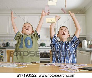 Stock Photo - two young boys 
with play money. 
fotosearch - search 
stock photos, 
pictures, images, 
and photo clipart