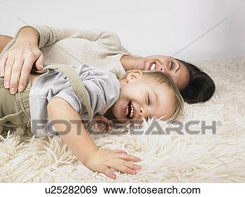 Stock Photograph - daughter and mother 
playing. fotosearch 
- search stock 
photos, pictures, 
images, and photo 
clipart