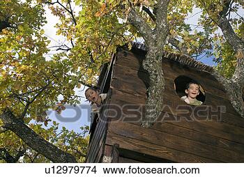 Stock Photo - kids playing in 
a tree house. 
fotosearch - search 
stock photos, 
pictures, images, 
and photo clipart