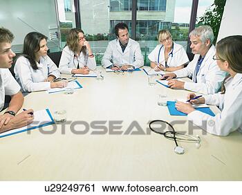 Stock Photography - group of doctors 
meeting in conference 
room. fotosearch 
- search stock 
photos, pictures, 
images, and photo 
clipart