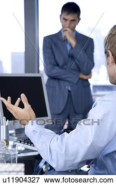 Picture - two male colleagues 
in a business 
meeting. fotosearch 
- search stock 
photos, pictures, 
images, and photo 
clipart