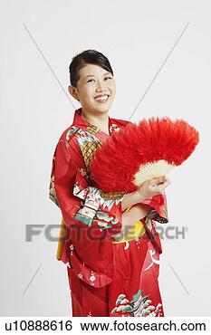 Stock Photo - portrait of a 
young woman holding 
a feather fan. 
fotosearch - search 
stock photos, 
pictures, images, 
and photo clipart