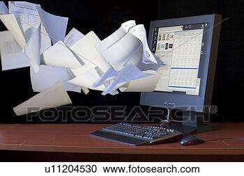 Stock Photography - documents flying 
into computer 
flat screen monitor. 
fotosearch - search 
stock photos, 
pictures, images, 
and photo clipart
