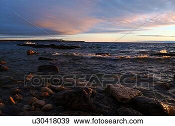 Stock Photograph - morning light 
with waves in 
isthmus bay. fotosearch 
- search stock 
photos, pictures, 
images, and photo 
clipart