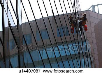 Picture - window washer 
reflected in highrise 
glass windows. 
fotosearch - search 
stock photos, 
pictures, images, 
and photo clipart