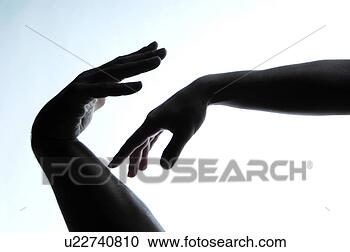 Stock Photography - silhouettes of 
male and female 
hand touching. 
fotosearch - search 
stock photos, 
pictures, images, 
and photo clipart