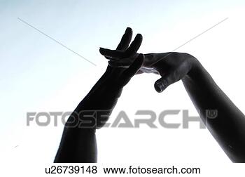 Stock Photo - silhouettes of 
male and female 
hand, fingers 
interlocked. fotosearch 
- search stock 
photos, pictures, 
images, and photo 
clipart