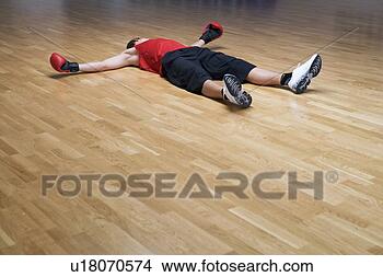 Stock Photo - a boxer laying 
on the floor. 
fotosearch - search 
stock photos, 
pictures, images, 
and photo clipart