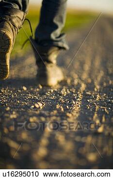 Stock Photography - close-up boots 
walking along 
gravelled road, 
 rural saskatchewan. 
fotosearch - search 
stock photos, 
pictures, images, 
and photo clipart