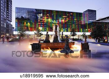 Stock Image - place jean-paul-riopelle, 
 the joust sculpture 
fountain,  and 
palais. fotosearch 
- search stock 
photos, pictures, 
images, and photo 
clipart