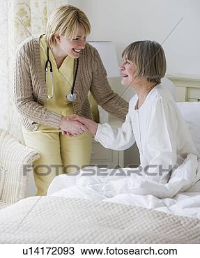 Stock Photo - nurse helping 
senior woman out 
of bed. fotosearch 
- search stock 
photos, pictures, 
images, and photo 
clipart