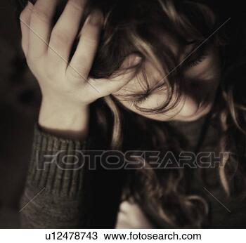 Stock Photo - woman holding 
head in hand. 
fotosearch - search 
stock photos, 
pictures, images, 
and photo clipart