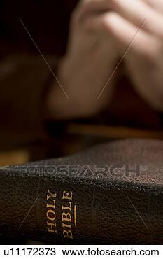 Stock Photo - closeup of bible 
with praying hands. 
fotosearch - search 
stock photos, 
pictures, images, 
and photo clipart