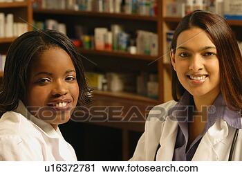 Stock Photography - two female pharmacists. 
fotosearch - search 
stock photos, 
pictures, images, 
and photo clipart