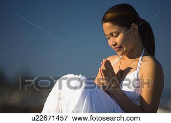 Picture - a young woman 
praying. fotosearch 
- search stock 
photos, pictures, 
images, and photo 
clipart